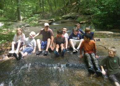 Children playing in creek at Charlie Elliott Wildlife Center