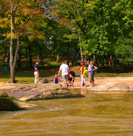 Family exploring Hurricane Shoals River